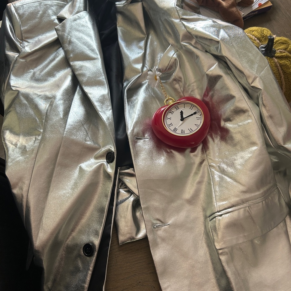 Silver suit with tie clock not included
